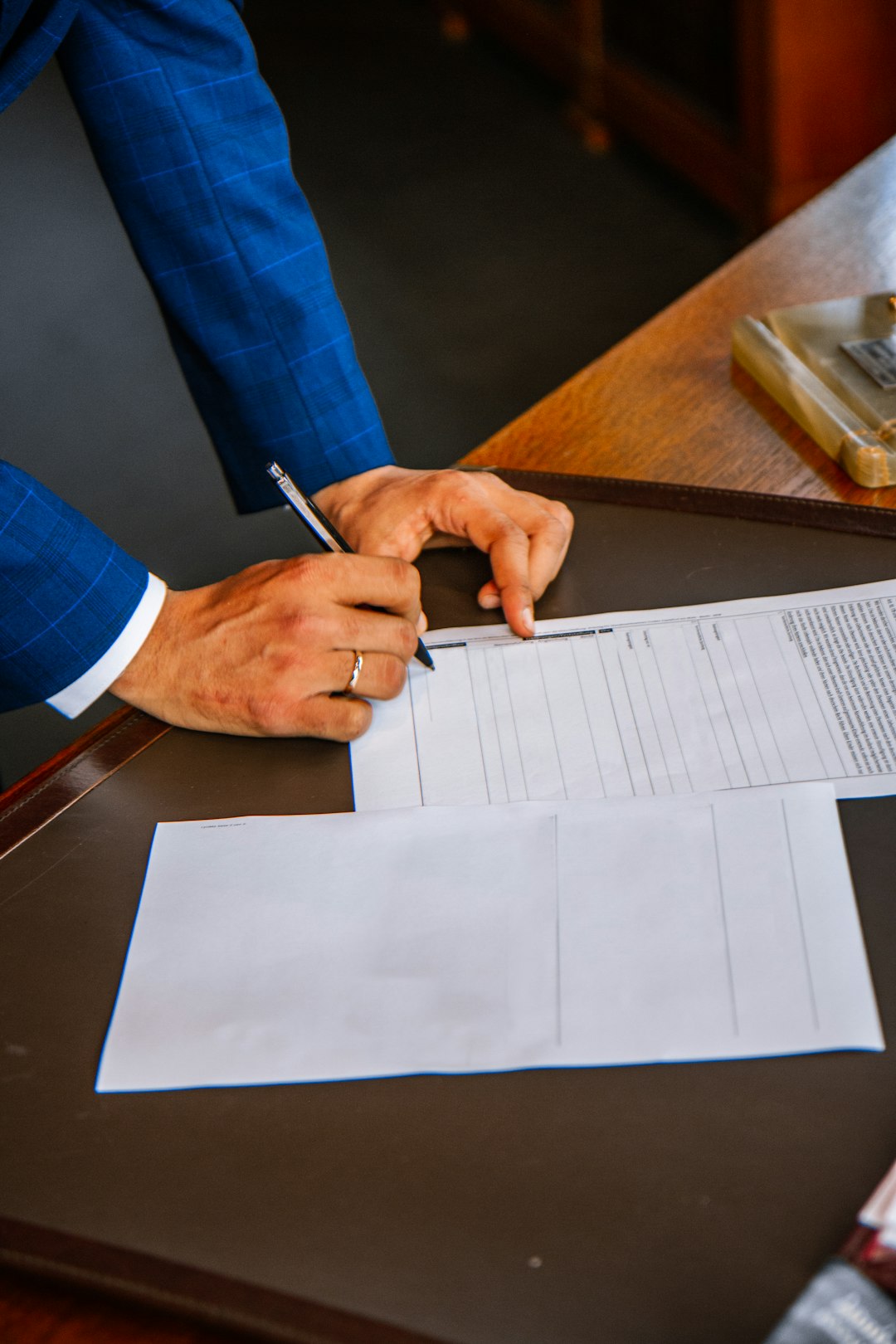 services-01 person-writing-on-white-form-paper-9i5eqbarv-k